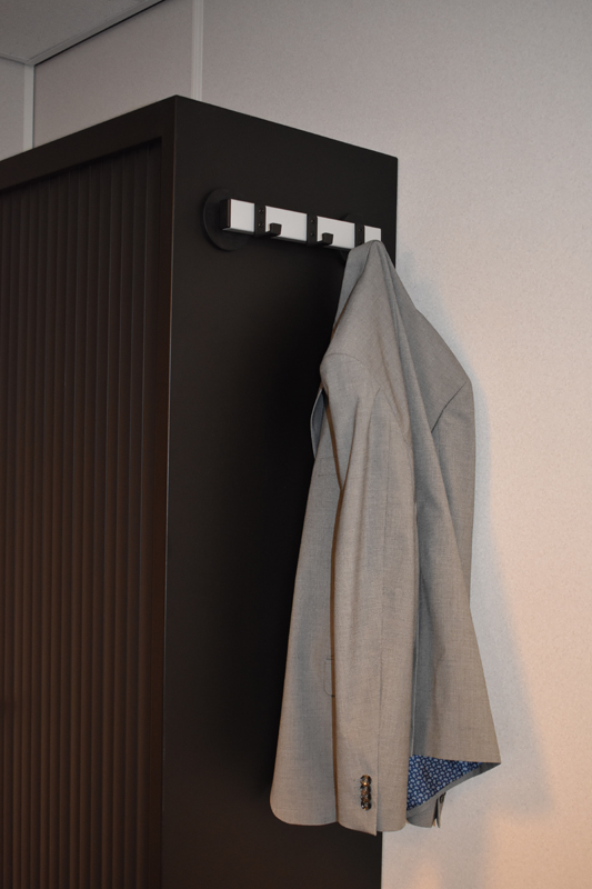 Magnetic wall mounted coat rack
